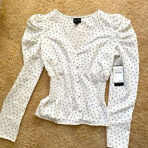 Peplum long sleeve polka dotted blouse